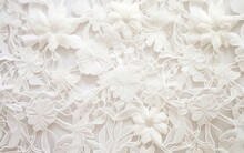 Closeup Of Textured Fabric Pattern With Elegant Vintage Lace And Floral Hand Embroidery On A White Background. Decorative Wedding Design.