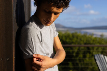 Caucasian man wearing grey short sleeved t shirt in nature with copy space