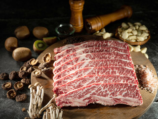 Wall Mural - Frozen LA beef ribs with various spices, fruits and vegetables