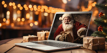 Santa Claus With Boxes Of Gifts In His Hands On Laptop Video Call Interface Screen. Сhristmas, Festivity And Communication Technology.Online Congratulations. Congratulations During The Coronavirus