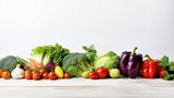 Fototapeta Kuchnia - Fresh and vibrant vegetables arranged neatly against a white background