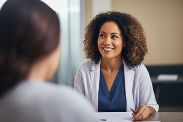 Poster - A female oncologist sits at her desk, discussing treatment options 