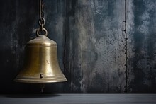 Brass Ships Bell Against Grey Metal Wall