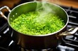 stirring bright green pea soup in a pot on the stove