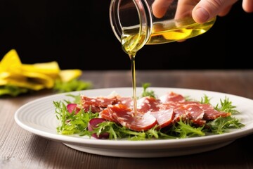 Poster - hand drizzling olive oil over a salami salad