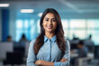 © PRASANNAPIX - Successful young Indian businesswoman standing in office