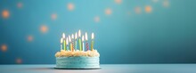 Photo Of Birthday Cake With Candles On Pastel Blue