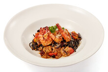 Black Squid Pasta Stir Fried With Tiger Shrimp And Dried Chilli (Thai Style) In White Plate Isolated On White Background.