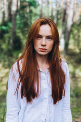 Wall Mural - Beautiful woman natural face freckles casual female portrait lifestyle beauty girl. Outdoor girl portrait in green summer forest