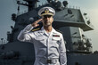 Young indian confident ship captain standing in uniform, saluting
