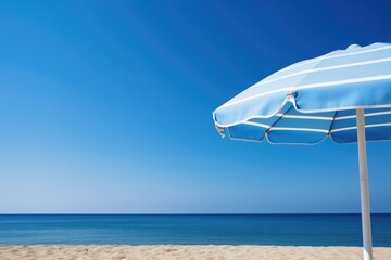 a blue beach umbrella against clear sky