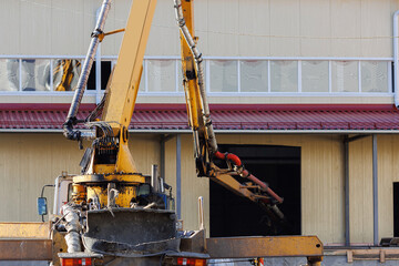 Poster - concrete pump working on construction building site