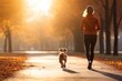 © Nijieimu - A person jogging with their dog as a fun way to exercise