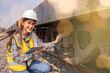 © ฺฺฺBoonterm - Female railway technician engineer wearing hardhat and vest does field work inspecting bogies underbody device that supports the weight train carriages responsibly controls sway of the train wheels.