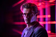 © Tetiana - Generative AI image of nice serious guy in a nightclub illuminated by neon blurred lights