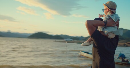 Poster - happy asian Family Love Father Carrying Daughter on Shoulder Embracing and watching Golden Hour Joy sunset together on Beachside, Share Precious Sunset Beach Moment