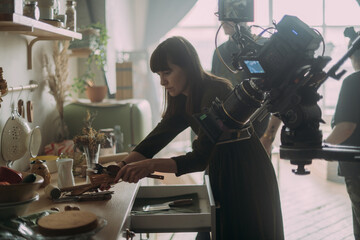 The production designer prepares the scenery on the set. The artist's work in building a frame for filming a movie