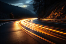 Car Lights Trail Through The Winding Mountain Road