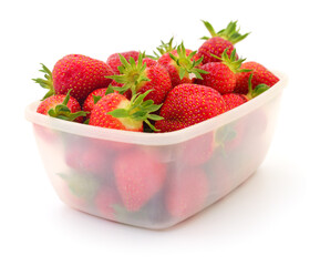 Canvas Print - Red ripe strawberries in plastic tray container.