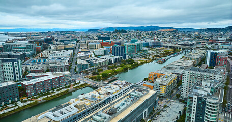 Wall Mural - Aerial Mission Bay with city buildings and distant mountainous skyline