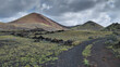 Volcanic landscape and path in Timonfaya National Park, Lanzarote, Canary Islands, Spain