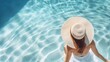 Beautiful girl wearing a swimming suit and straw hat relaxing on a swimming ring in the pool at a luxury resort, Summer holiday and vacation concept for tourism.