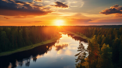 Wall Mural - Aerial view of sundown over a river, vibrant reflection on water, meandering through a forest