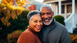 Portrait of a happy mature black couple in their home outdoors.