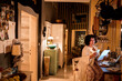 © Marko Geber - Wide angle view of a middle aged woman paying bills online at home