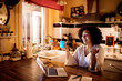© Marko Geber - Cheerful middle aged woman talking to a friend on a video call from home