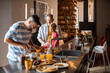 © Marko Geber - Young gay family preparing breakfast in the kitchen