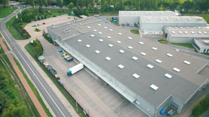 Sticker - Warehouse storages or industrial factory or logistics center from above. Aerial view of industrial buildings and equipment machines. Aerial view