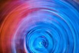 Fototapeta Tęcza - Bright neon blue ripple blur in artistic abstract artwork with orange flare on left side
