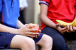 © Austockphoto - primary school student holding healthy apple for fruit break