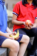 © Austockphoto - primary school student holding healthy banana for fruit break