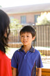 © Austockphoto - primary school students talking together