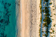 © Austockphoto - Looking down on ocean, beach, and coastal pathway.