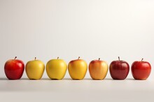 Photo Of Seven Red And Yellow Apples Standing In A Row On A White Minimalistic Background. Fresh, Appetizing, Tasty And Healthy Fruits.
