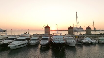 Wall Mural - Sunrise at the Old windmills of Mandraki in Rhodes harbour, Greeceject