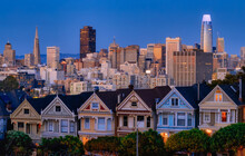 Evening, Painted Ladies Victorian Houses In Alamo Square And A View Of The San Francisco Skyline And Skyscrapers. Photo Processed In Pastel Colors