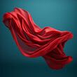 Red fabric flying through the air, dark cyan, slumped, draped.