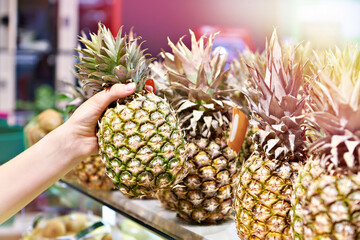 Wall Mural - Pineapple in hand in shop