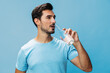 © SHOTPRIME STUDIO - Man healthy t-shirt attractive studio drink sport smile water bottle happy lifestyle