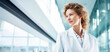 © AngrySun - Beautiful female healthcare worker. Doctor or nurse in white coat. Medical concept. Generative AI