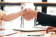 © Pichsakul - Two businesswomen shaking hands together after collaboration about marketing strategy of business