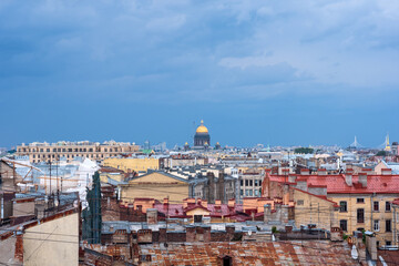 Wall Mural - top view of the city roofs in the historical center of Saint Petersburg with rainy sky