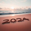 2024 written in the sand on a beach with your finger 