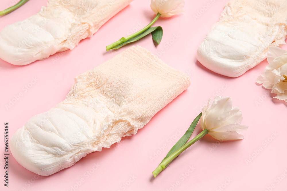 Period panties with tulips on pink background, closeup