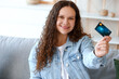© Pixel-Shot - Beautiful young woman with credit card shopping online at home