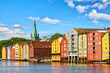 Old wooden houses  and Nidaros cathedral over Nidelva river in Trondheim, Norway